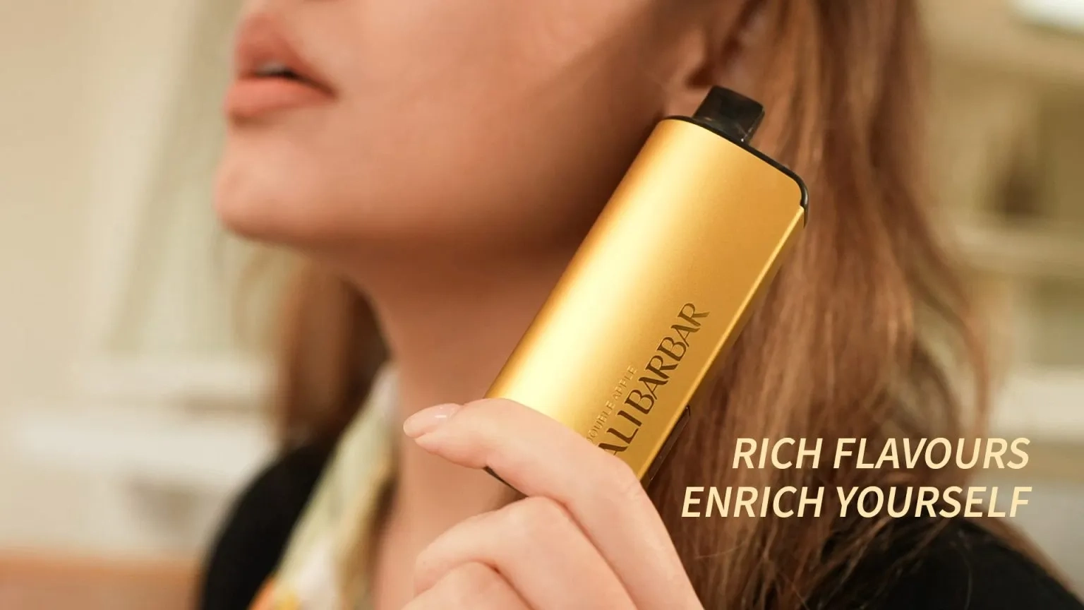 A person thoughtfully holding a vape device, considering which of the best alibarbar vape flavours to choose.